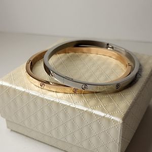 2 bracelets silver and gold